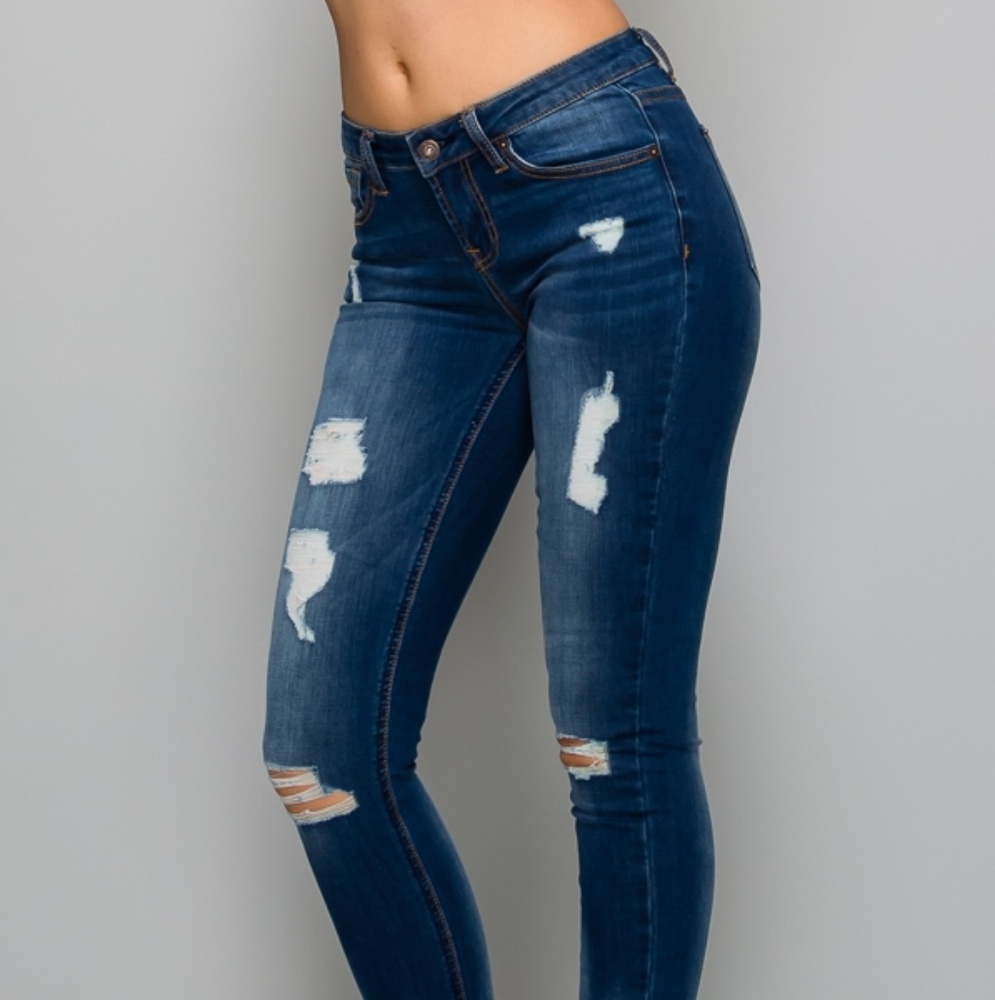 Dark distressed blue jeans